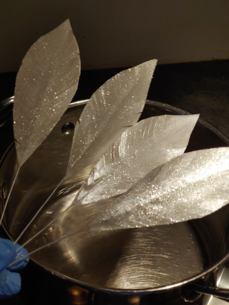sparkly feathers over pot